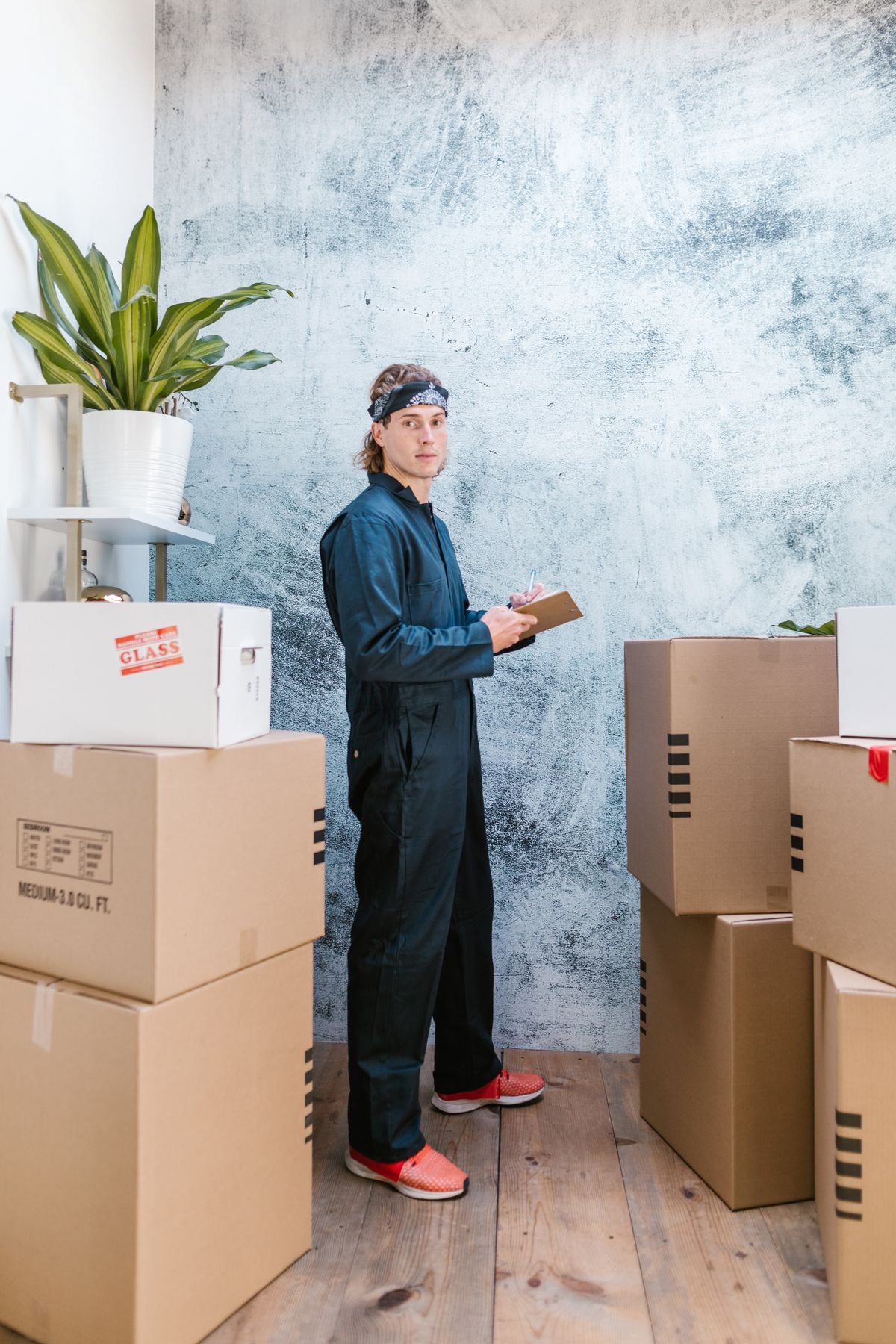 drain-cleaning Movers carrying a couch for residential junk removal