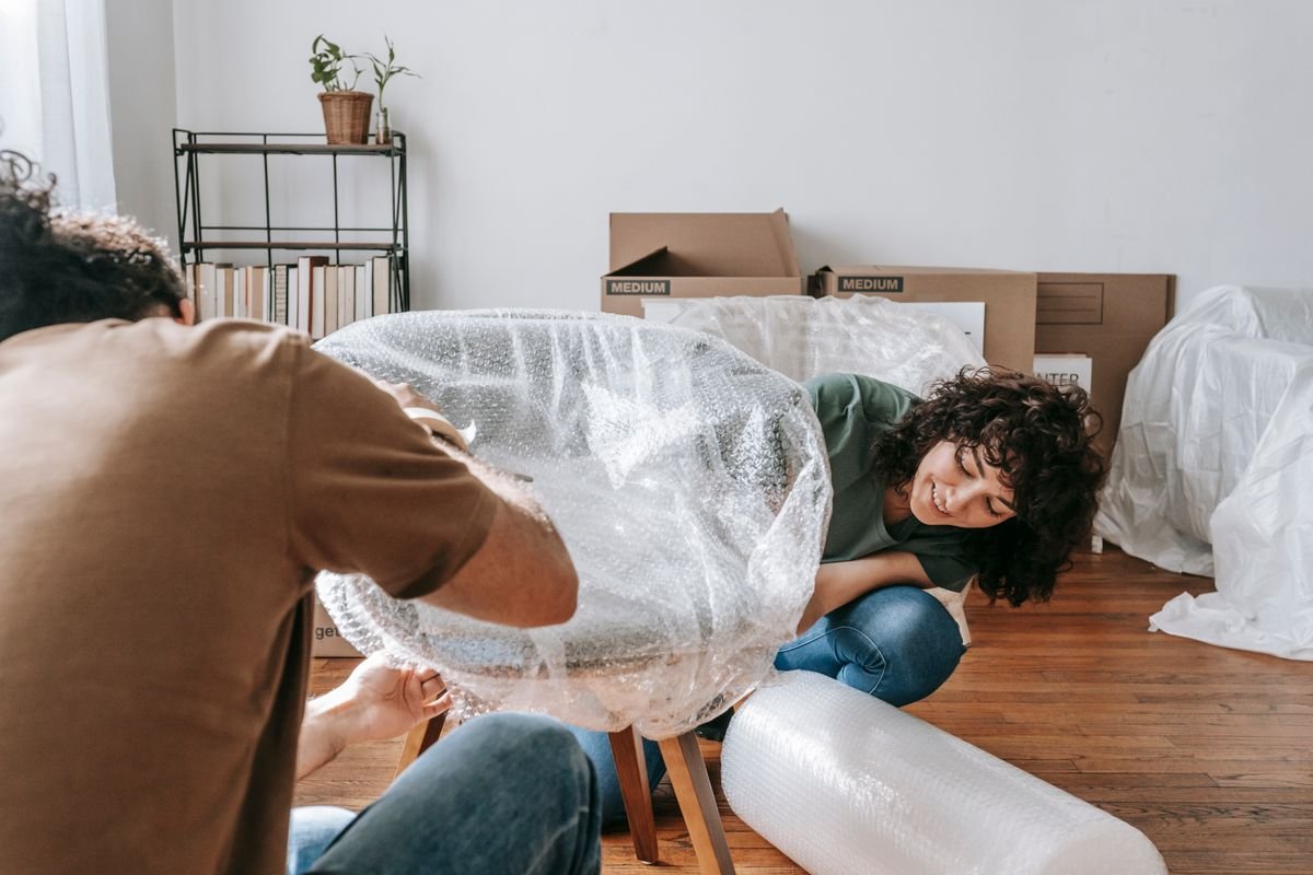 Team moving furniture out of a home